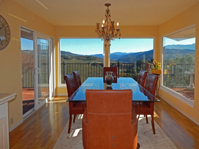 25530 Vía Paloma Carmel, CA 93923 - Photo 2 of 23 a view of a dining room with furniture a chandelier and wooden floor
