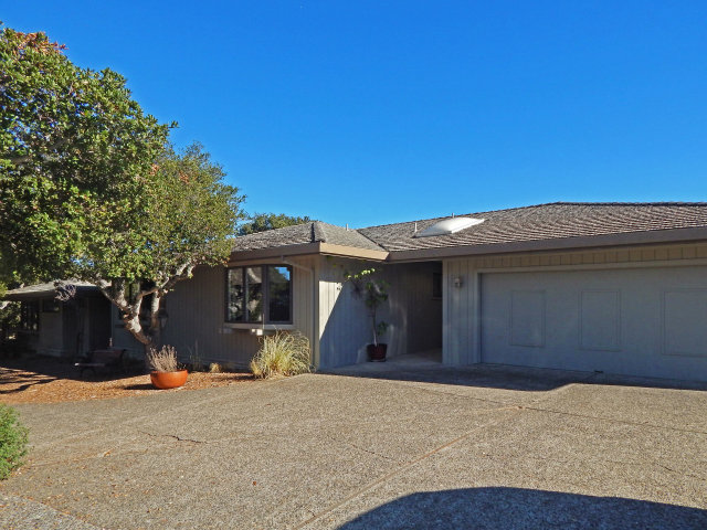 25530 Vía Paloma Carmel, CA 93923 - Photo 23 of 23 a front view of a house with a yard and garage