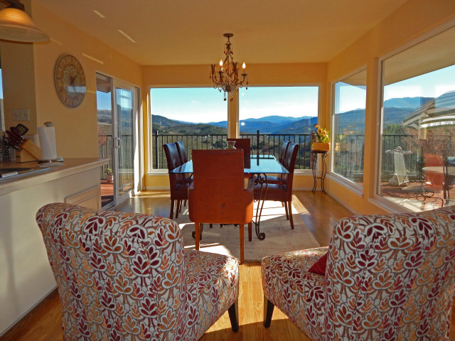 25530 Vía Paloma Carmel, CA 93923 - Photo 3 of 23 a view of a dining room with furniture wooden floor and chandelier