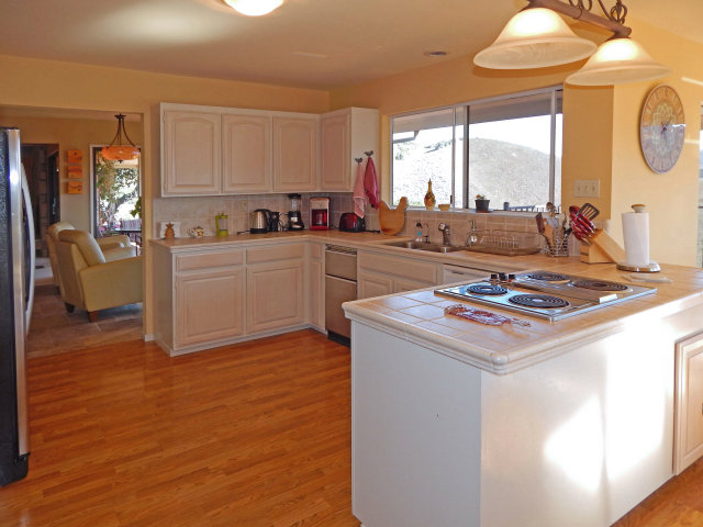25530 Vía Paloma Carmel, CA 93923 - Photo 4 of 23 a kitchen with a stove and a white refrigerator