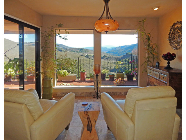 25530 Vía Paloma Carmel, CA 93923 - Photo 5 of 23 a living room with furniture and a floor to ceiling window