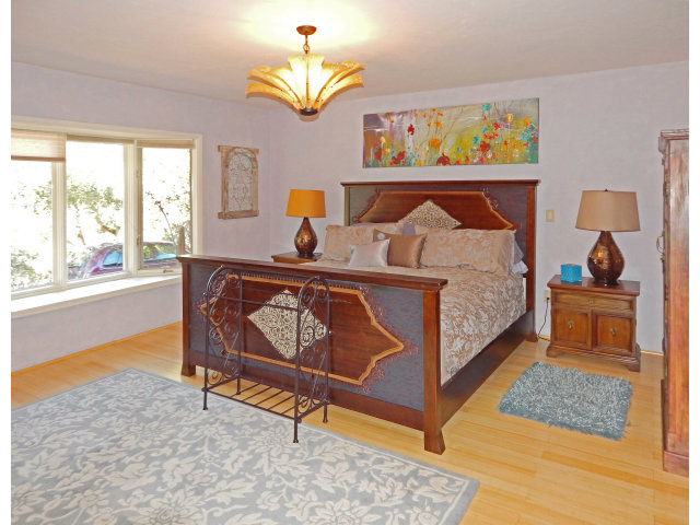 25530 Vía Paloma Carmel, CA 93923 - Photo 8 of 23 a bedroom with a bed and a window