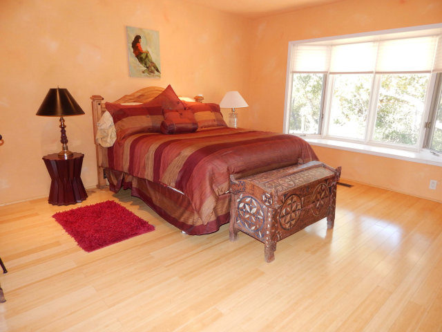 25530 Vía Paloma Carmel, CA 93923 - Photo 9 of 23 a bed sitting in a bedroom next to a window