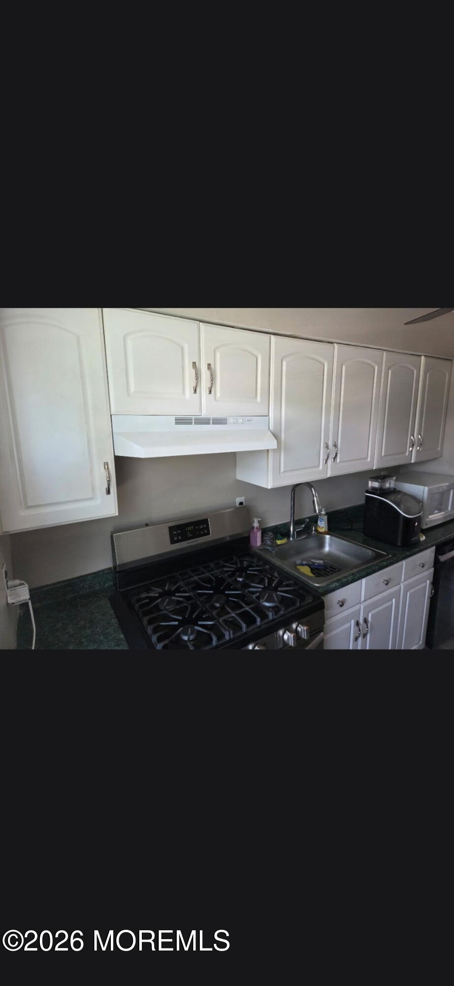 166 Sawmill Road, Unit 563 Brick, NJ 08724 - Photo 10 of 14 a view of kitchen island with cabinets
