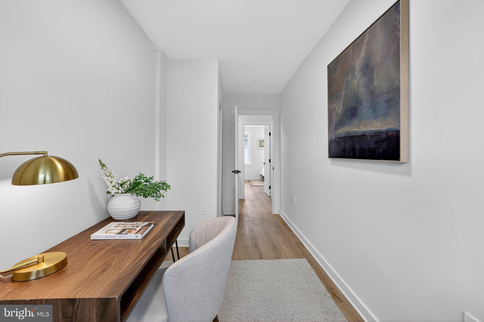777 18th Street Northeast Washington, DC 20002 - Photo 17 of 22 a living room with furniture and potted plant