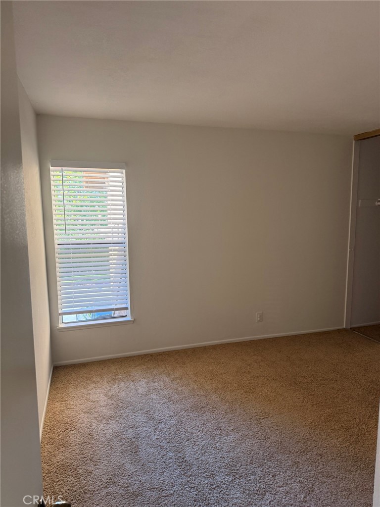 25 Orange Blossom, Unit 61 Irvine, CA 92618 - Photo 11 of 12 an empty room with a window