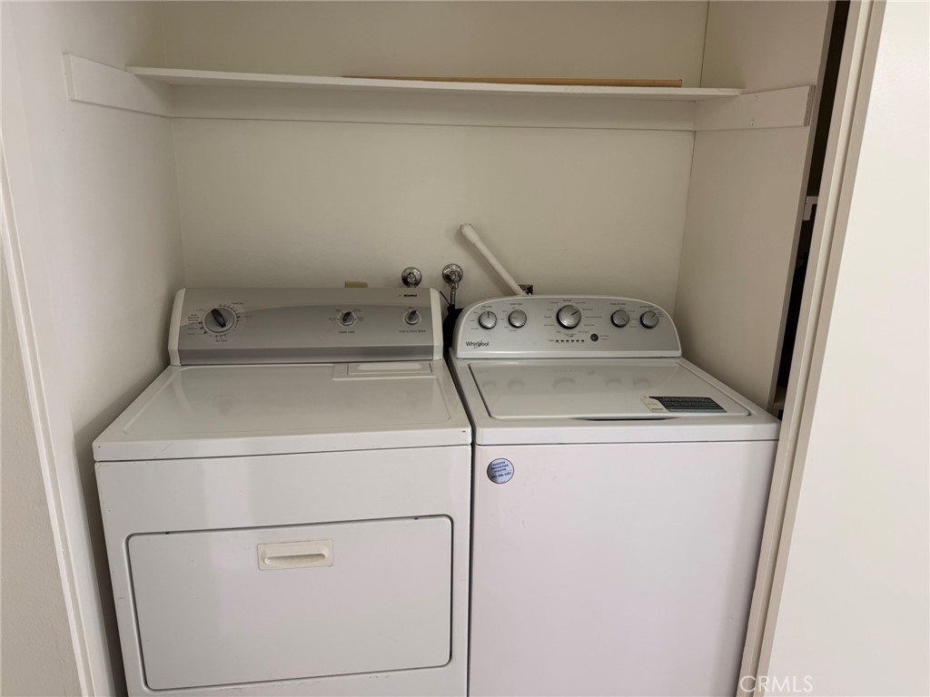 25 Orange Blossom, Unit 61 Irvine, CA 92618 - Photo 9 of 12 a utility room with dryer and washer