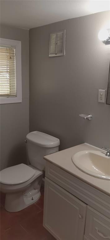 4135 B Hawthorne Avenue, Unit B Dallas, TX 75219 - Photo 5 of 7 Bathroom featuring vanity and dark tile patterned flooring