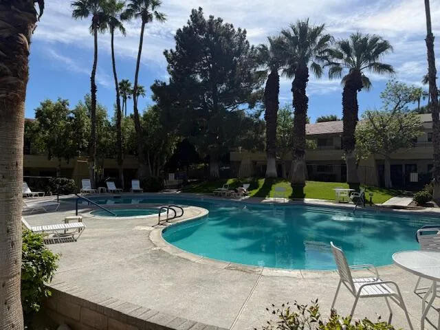 a view of a swimming pool with a patio