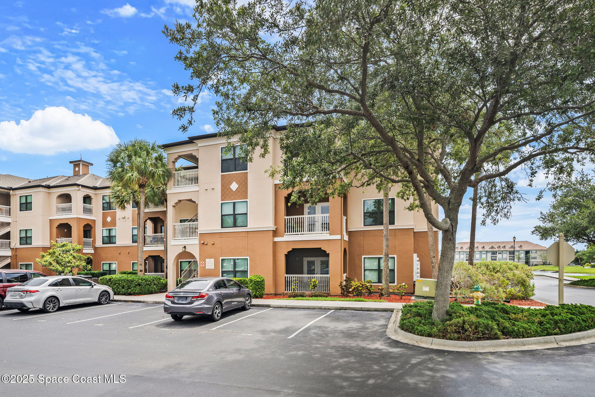 6421 Borasco Drive, Unit 3206 Melbourne, FL 32940 - Photo 2 of 36 a car parked in front of a white house