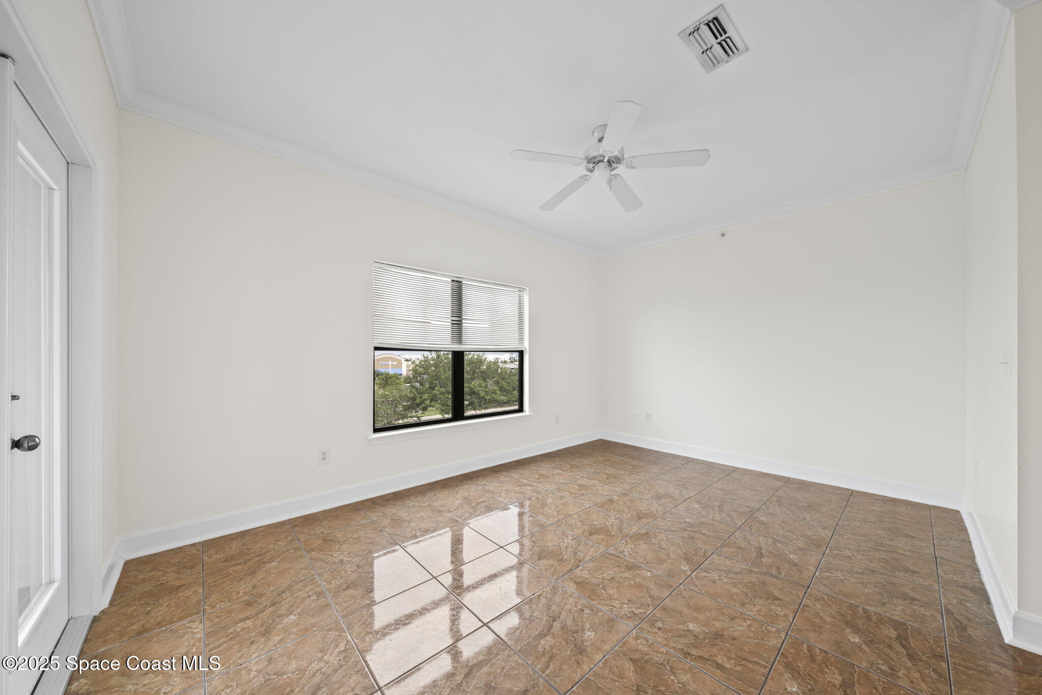 6421 Borasco Drive, Unit 3206 Melbourne, FL 32940 - Photo 22 of 36 a view of an empty room with a window