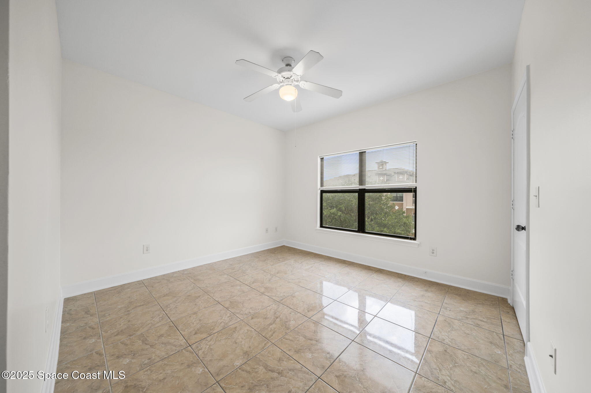 6421 Borasco Drive, Unit 3206 Melbourne, FL 32940 - Photo 27 of 36 a view of a big room with windows and chandelier fan
