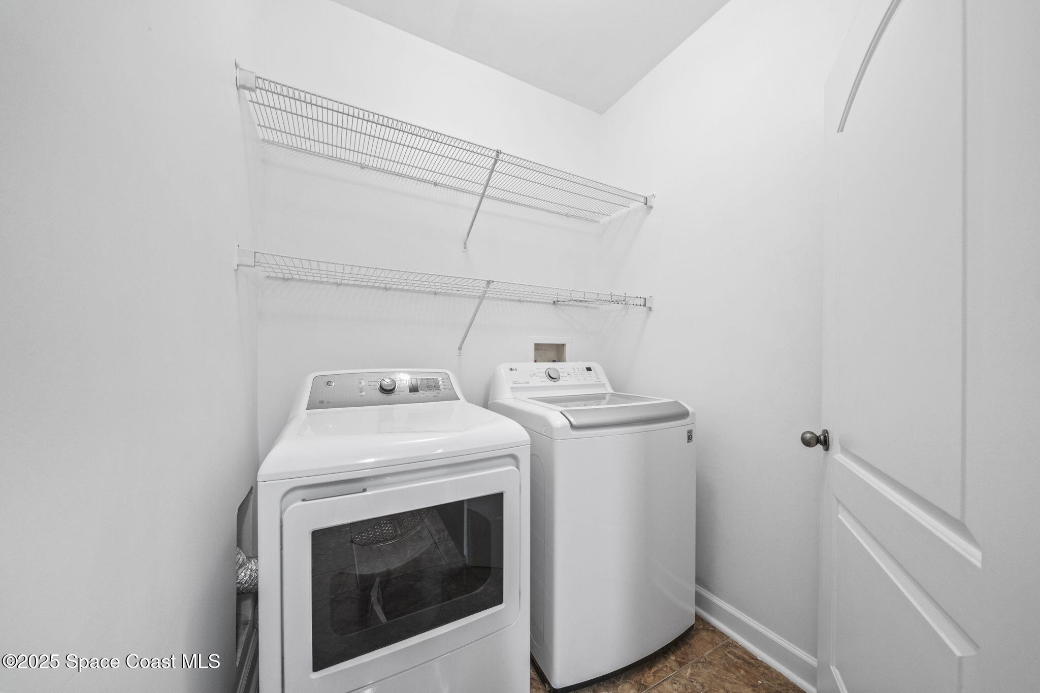 6421 Borasco Drive, Unit 3206 Melbourne, FL 32940 - Photo 30 of 36 a utility room with dryer and washer