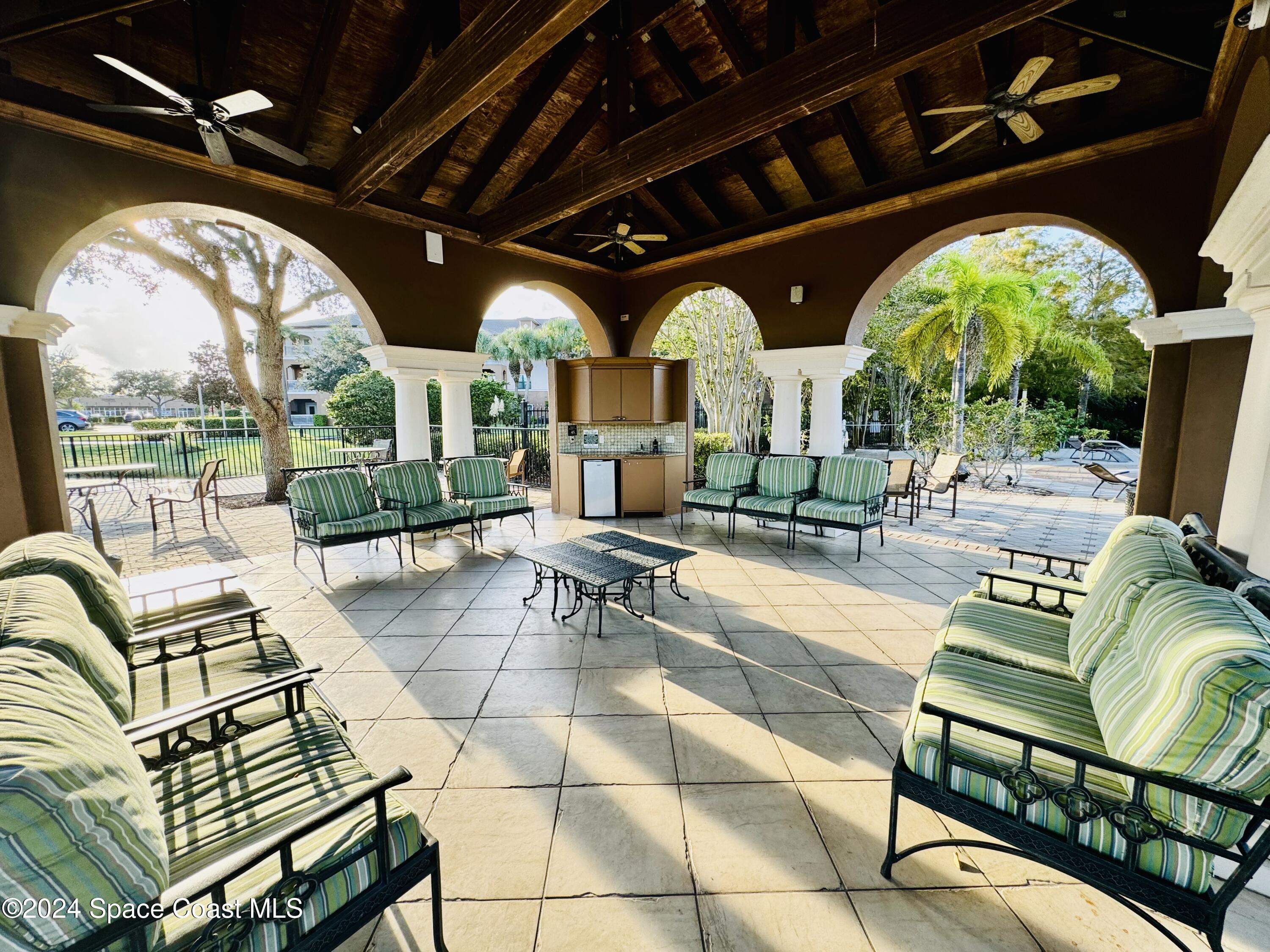 6421 Borasco Drive, Unit 3206 Melbourne, FL 32940 - Photo 36 of 36 a view of a swimming pool with outdoor seating