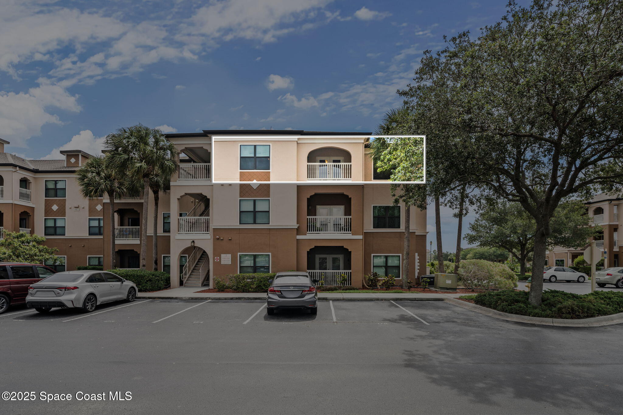 6421 Borasco Drive, Unit 3206 Melbourne, FL 32940 - Photo 6 of 36 a view of a street with cars