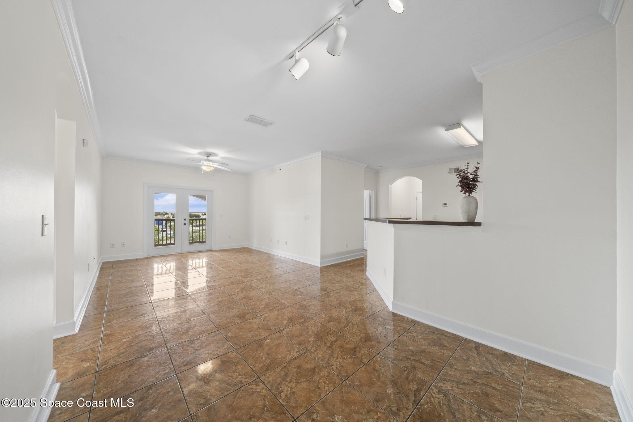 6421 Borasco Drive, Unit 3206 Melbourne, FL 32940 - Photo 10 of 36 a view of a kitchen with a sink and a refrigerator