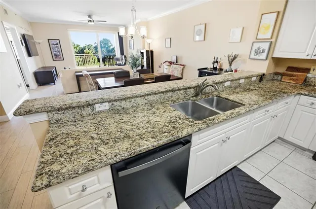 a kitchen with sink and microwave