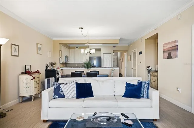 a large living room with stainless steel appliances kitchen island granite countertop furniture and a view of kitchen