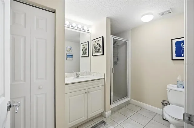 a bathroom with a toilet sink and shower