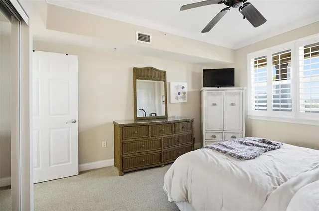 a bedroom with a bed and a television