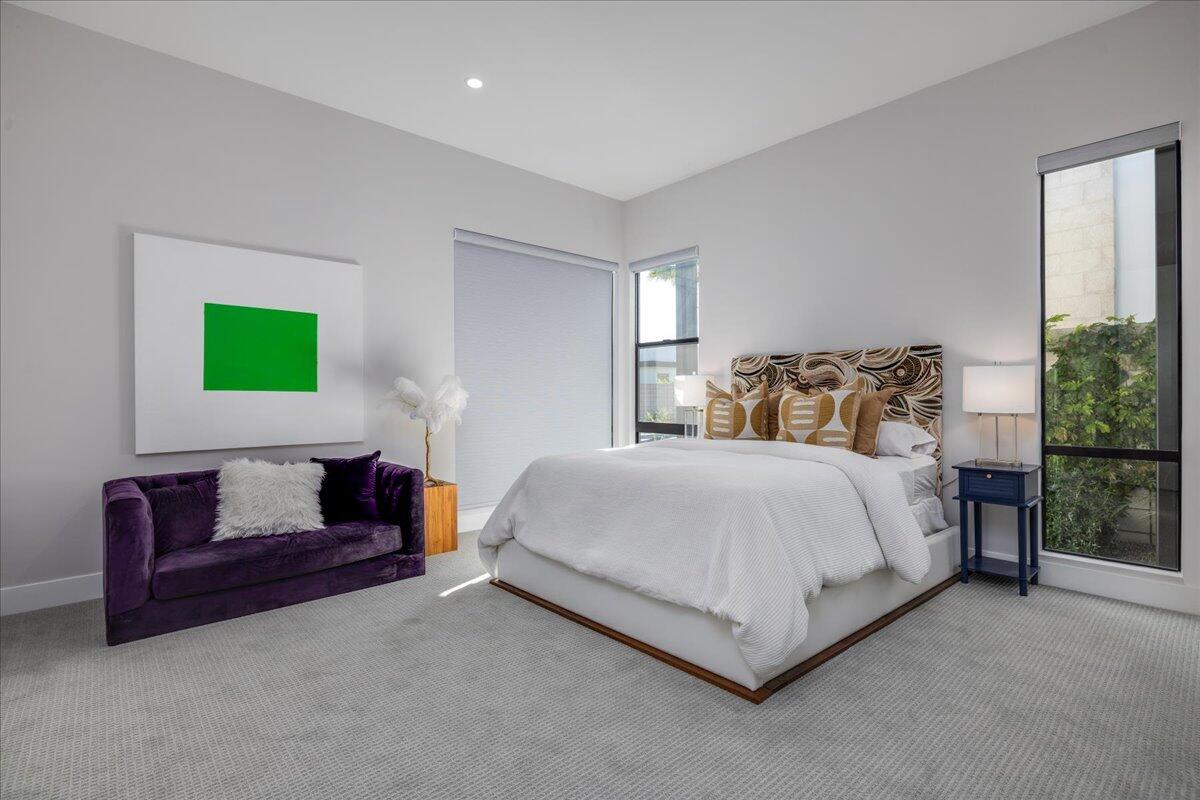 151 Holliday Way Palm Springs, CA 92262 - Photo 25 of 40 a bedroom with a bed and a couch