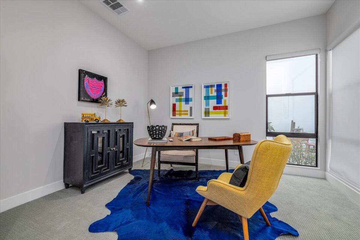 151 Holliday Way Palm Springs, CA 92262 - Photo 29 of 40 a living room with furniture a rug and a window