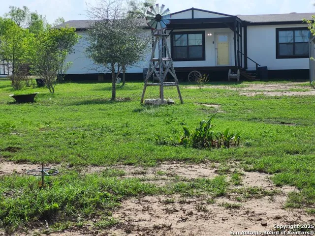 a small pool is sitting in the grass