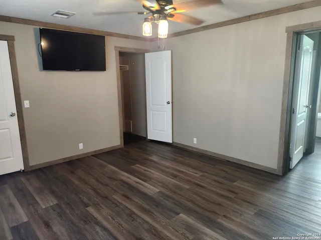 a view of a livingroom with wooden floor