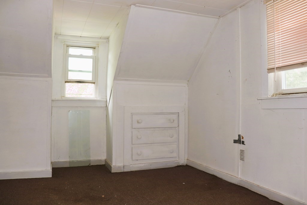 231 Rosewell Street Springfield, MA 01109 - Photo 23 of 24 an empty room with windows and closet