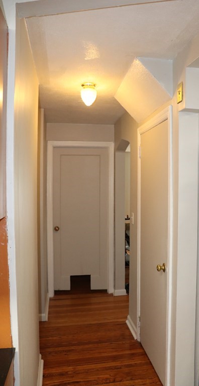 231 Rosewell Street Springfield, MA 01109 - Photo 8 of 24 a view of a hallway with wooden floor