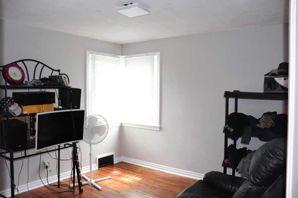 231 Rosewell Street Springfield, MA 01109 - Photo 9 of 24 a view of a workspace with furniture and a window