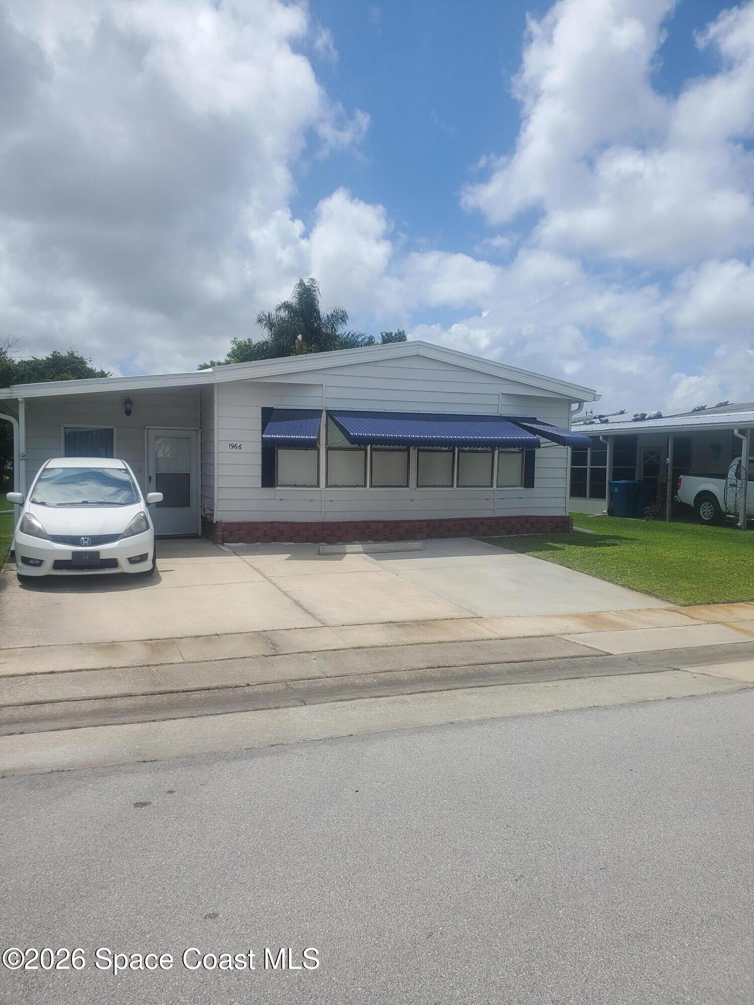 1966 Live Oak Street Northeast Palm Bay, FL 32905 - Photo 1 of 26 20260519_143237