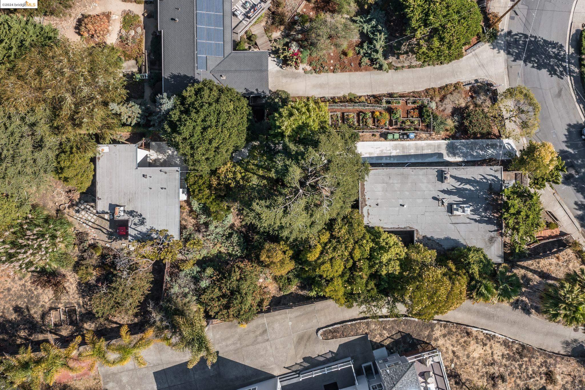 846 Sea View Drive El Cerrito, CA 94530 - Photo 1 of 1 an aerial view of a house with a yard and garden