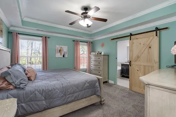 a bed room with a bed and a window