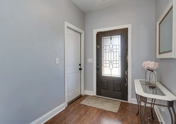 a spacious bedroom with a bed and a window