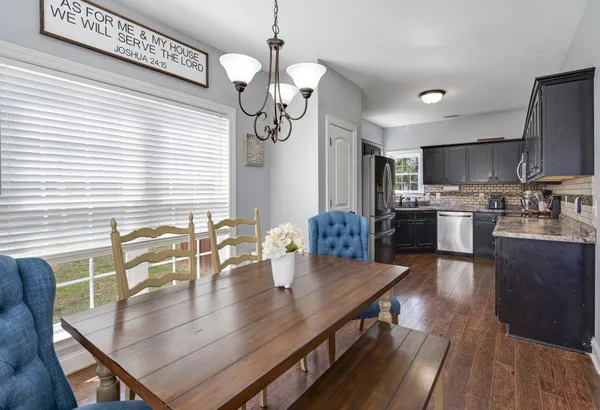 a kitchen with granite countertop stainless steel appliances and wooden cabinets