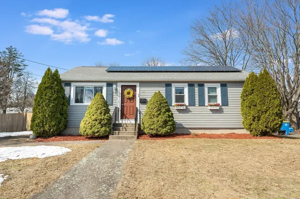 front view of a house with a garden
