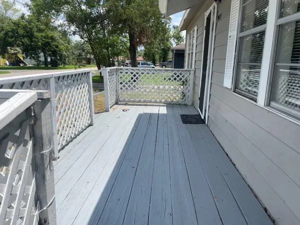 a view of deck with wooden floor and seating space