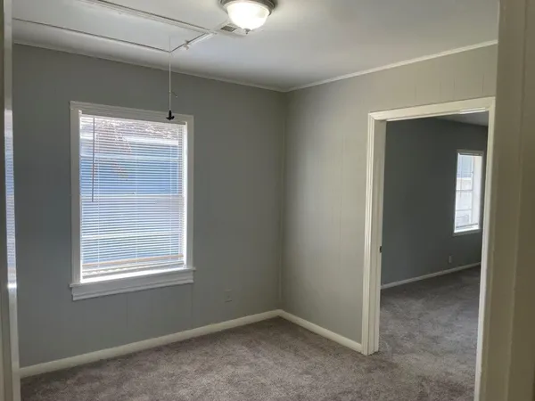 a view of an empty room with a window