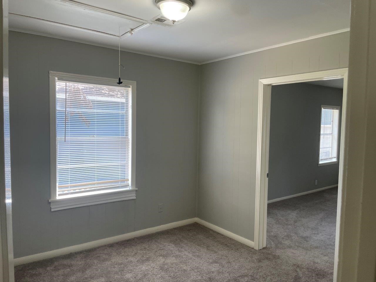 905 North Arcola Street Angleton, TX 77515 - Photo 8 of 17 a view of an empty room with a window