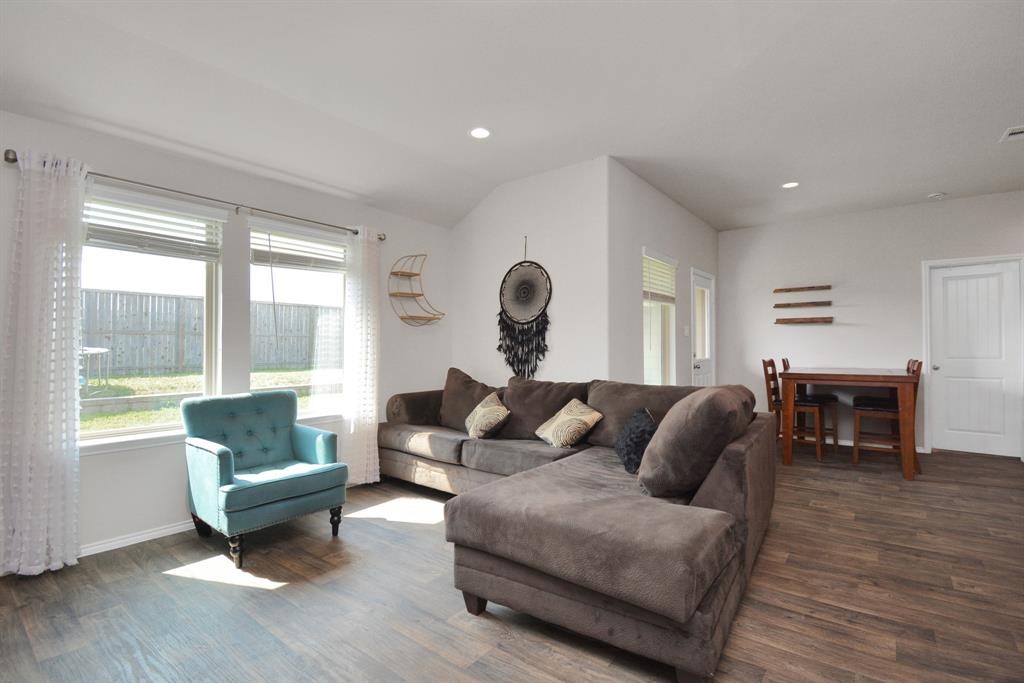 1602 Brownwood Ridge Court Richmond, TX 77469 - Photo 14 of 35 a living room with furniture and a large window