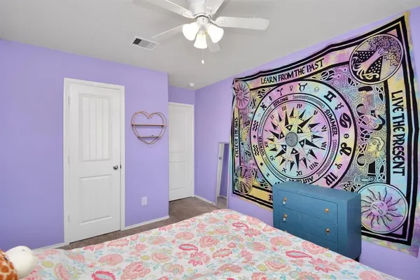 a bedroom with a bed and furniture