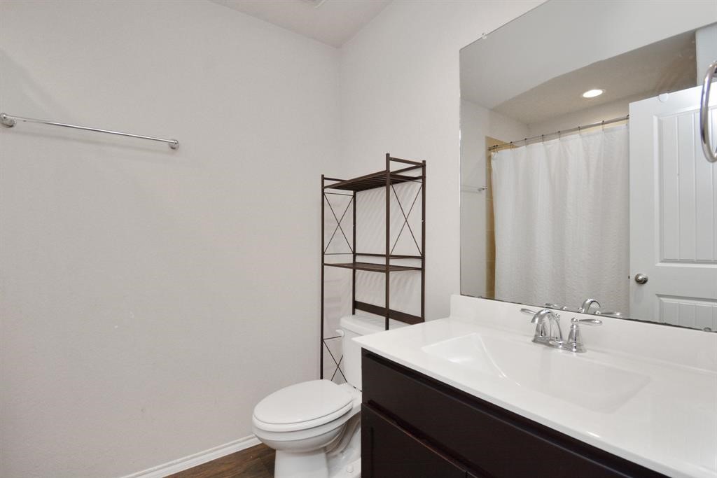 1602 Brownwood Ridge Court Richmond, TX 77469 - Photo 25 of 35 a bathroom with a sink a toilet and shower