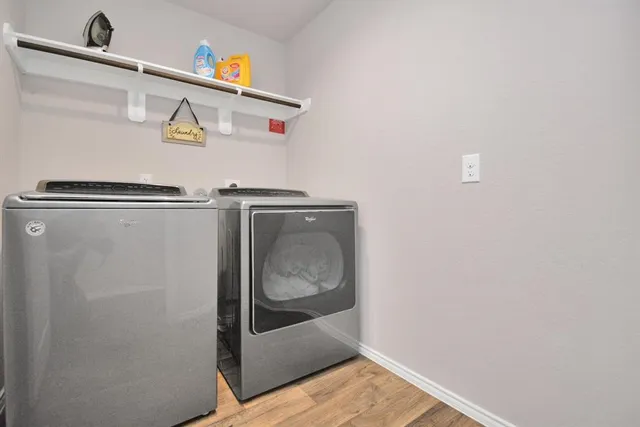 a utility room with dryer and washer