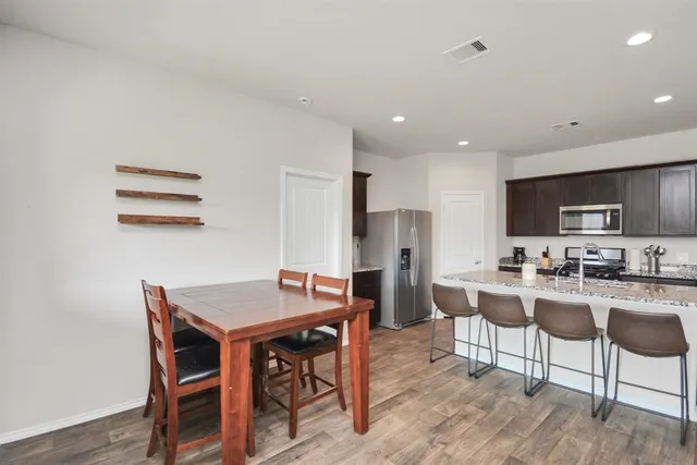 a view of a dining room with furniture