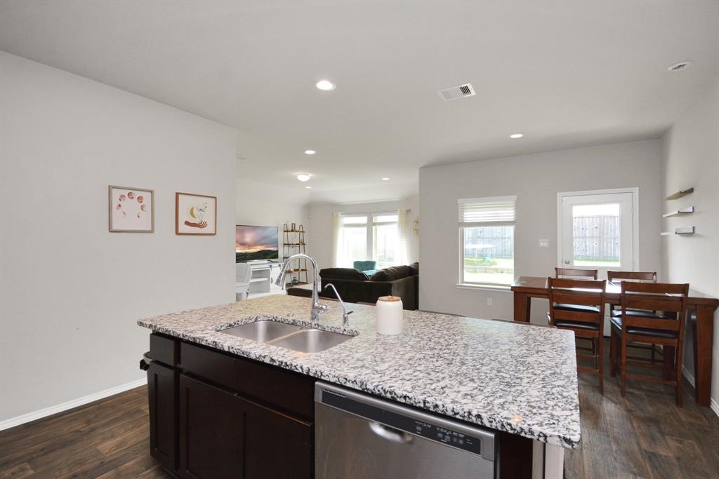 1602 Brownwood Ridge Court Richmond, TX 77469 - Photo 10 of 35 a kitchen with counter space and dining table