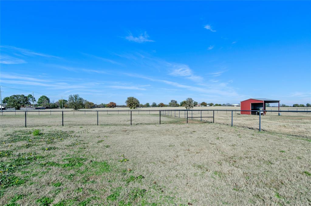 395 Yacht Club Road Oak Point, TX 75068 - Photo 20 of 23 View of yard featuring a view of countryside and an outbuilding