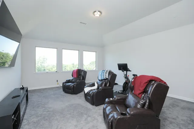 a bathroom with a tub sink and a mirror