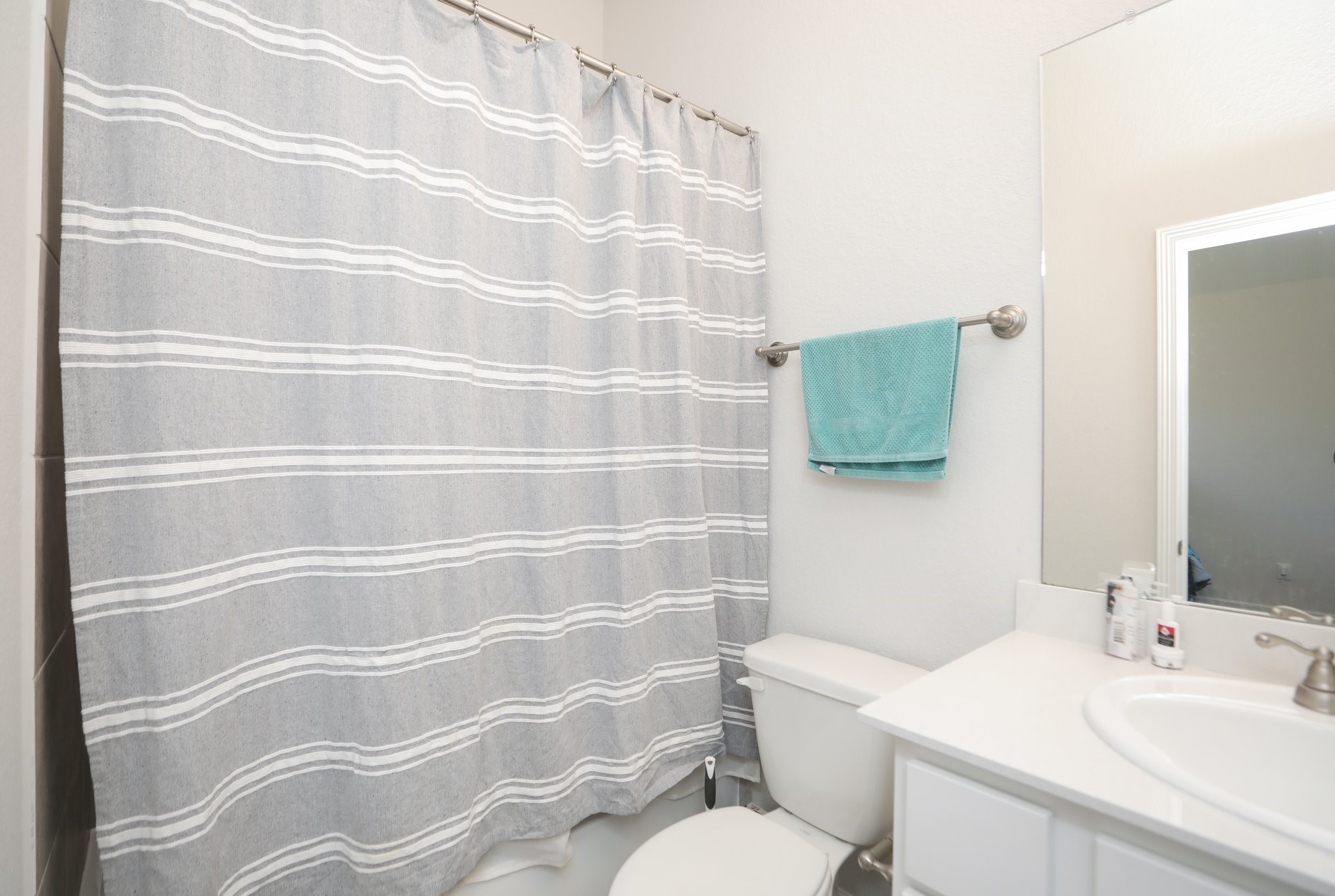 10134 Blythe Street Rosharon, TX 77583 - Photo 39 of 50 a bathroom with a sink toilet and shower