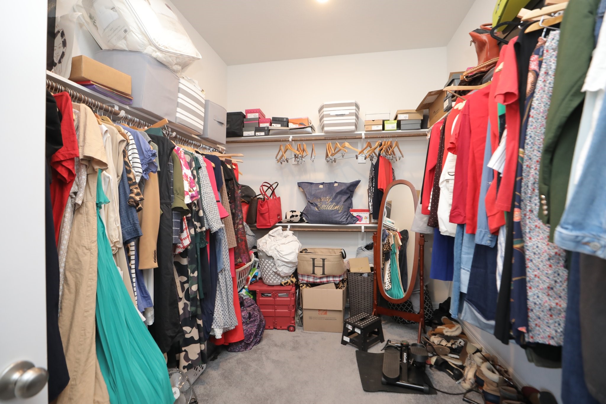 10134 Blythe Street Rosharon, TX 77583 - Photo 46 of 50 a view of walk in closet with clothes
